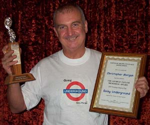 Award-winning playwright Christopher Morgan pictured (surprisingly enough) winning an award.